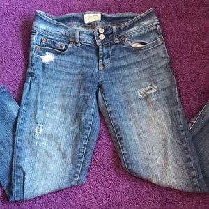 Distressed cropped skinny jeans